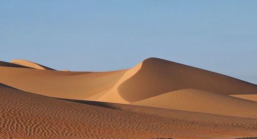 Scenic view of desert against clear sky