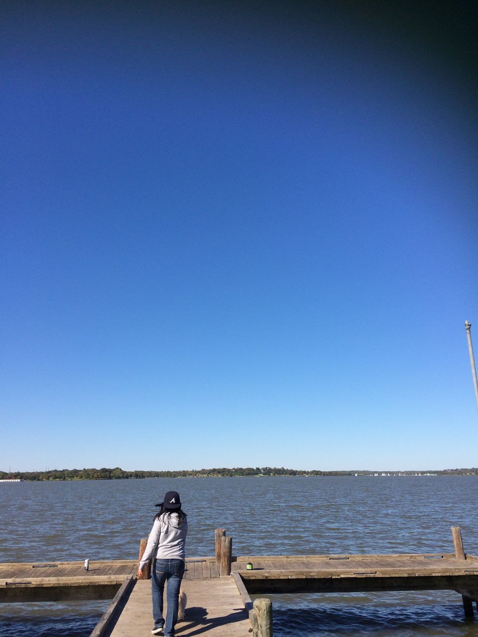 clear sky, copy space, sea, water, blue, horizon over water, tranquil scene, tranquility, built structure, scenics, building exterior, architecture, nature, calm, beauty in nature, no people, day, outdoors, sunlight, ocean