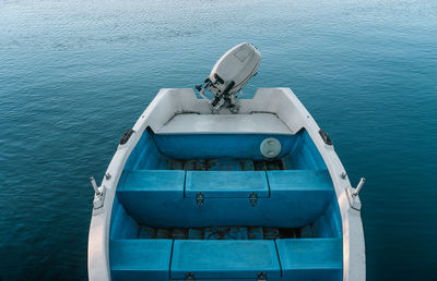 Docked blue fishing boat
