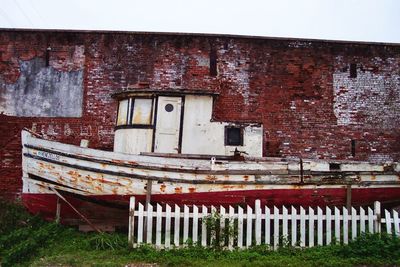 Old boat against building