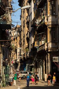 People walking on street in city