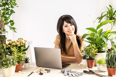 Young woman using laptop on table