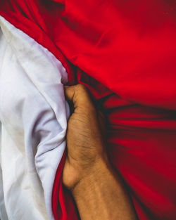 Holding the red and white indonesian flag