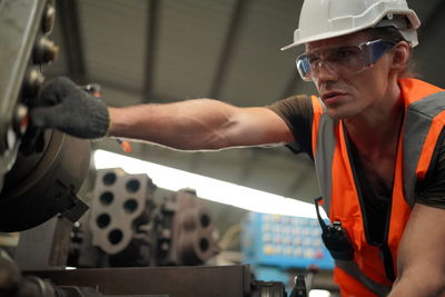 Rear view of man working at workshop