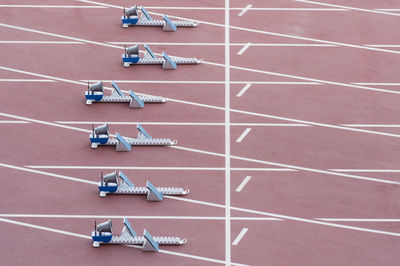 High angle view of starting block on running track in stadium 