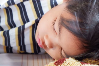 Close-up of woman sleeping on bed