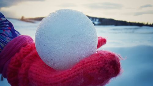 Close-up of snow against sky during winter