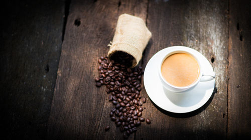 High angle view of coffee cup on table