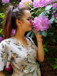 Beautiful woman with pink flower