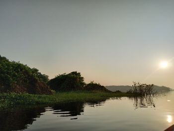 Scenic view of lake against sky during sunset