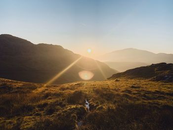 Scenic view of mountains against sky during sunset