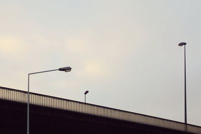 Low angle view of street light against sky