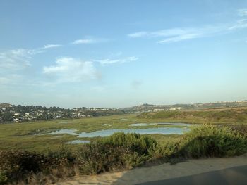 Scenic view of land against sky