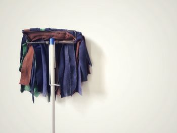 Close-up of clothes hanging on wall