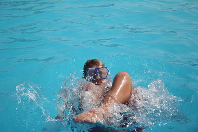 Young woman swimming in pool