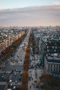 High angle view of traffic on road amidst buildings in city