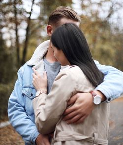 Couple embracing on road