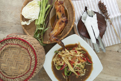 High angle view of vegetables in basket on table