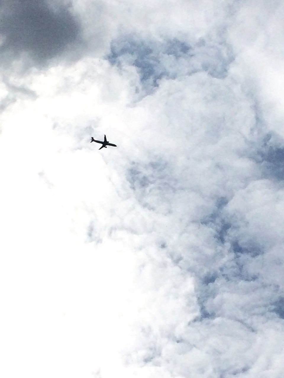 airplane, air vehicle, transportation, mode of transport, flying, mid-air, sky, low angle view, cloud - sky, on the move, travel, public transportation, journey, aircraft wing, commercial airplane, cloudy, helicopter, aircraft, cloud, day