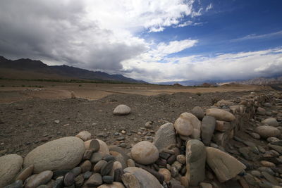 Rocks on land against sky