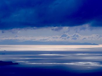 Scenic view of sea against cloudy sky