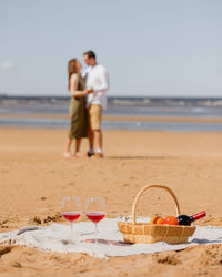 A couple of a man and a woman walk on the beach for a couple of lovers on a date