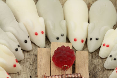 Mouse figurines around jelly food
