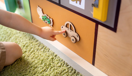 Cropped hand of woman holding toy blocks