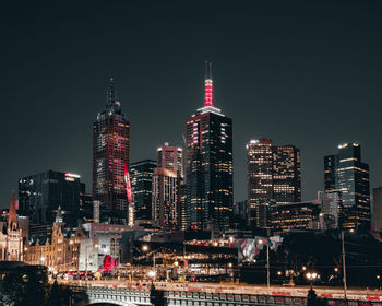 Illuminated buildings in city at night