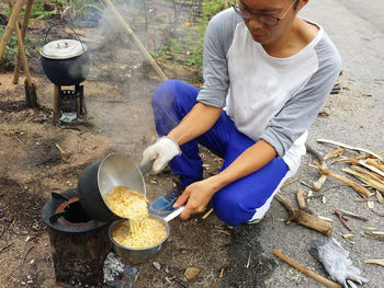 Midsection of man preparing food