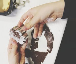 High angle view of woman preparing dessert