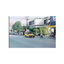 Cars on road against clear sky