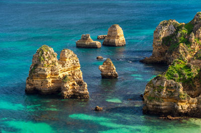 High angle view of rocks in sea