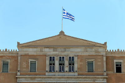 Low angle view of building against blue sky