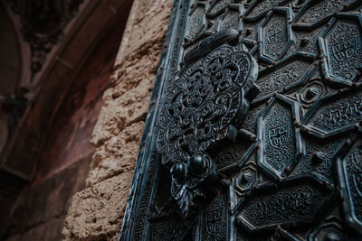 Low angle view of carving on old building