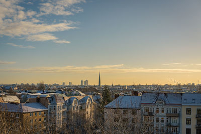 High angle shot of townscape against sky at sunset