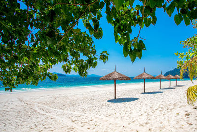 Umbrella wooden on tropical beach.