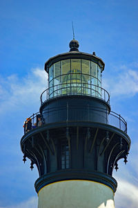 Low angle view of lighthouse against blue sky