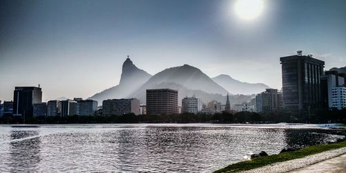 River with buildings against clear sky