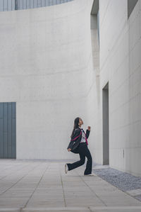 Side view of man walking on steps