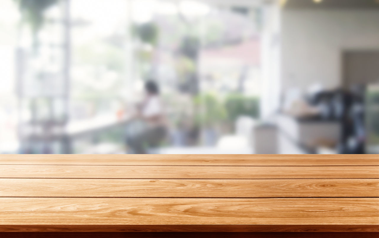 CLOSE-UP OF WOODEN TABLE AND BENCH