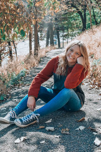 Portrait of woman sitting in park