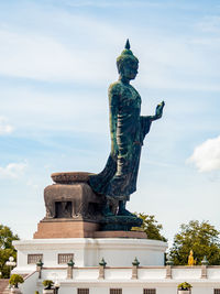 Low angle view of statue against sky