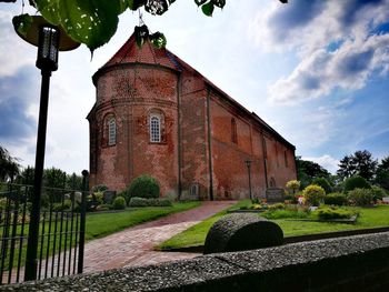 View of historical building against cloudy sky