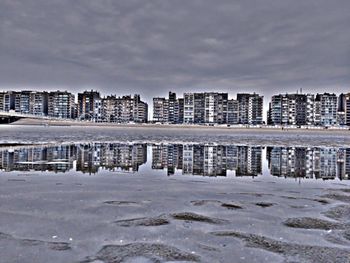 View of buildings against cloudy sky