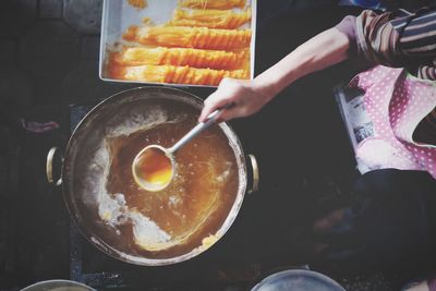 High angle view of man preparing food