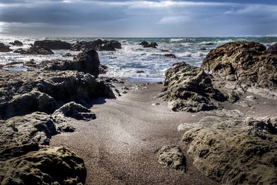 Scenic view of beach against sky