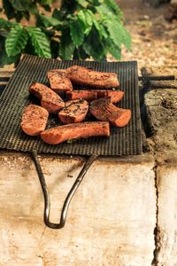 High angle view of meat on barbecue grill