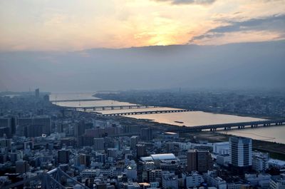 High angle view of buildings against sky during sunset