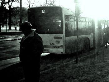 Rear view of woman standing in city